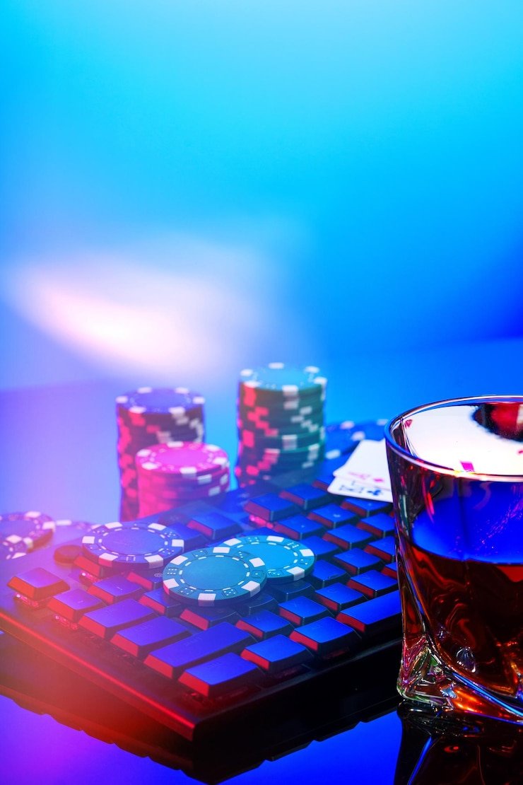 Blueprint Gaming baccarat table showing banker, player, and tie bet buttons with live dealer and shoe card display
